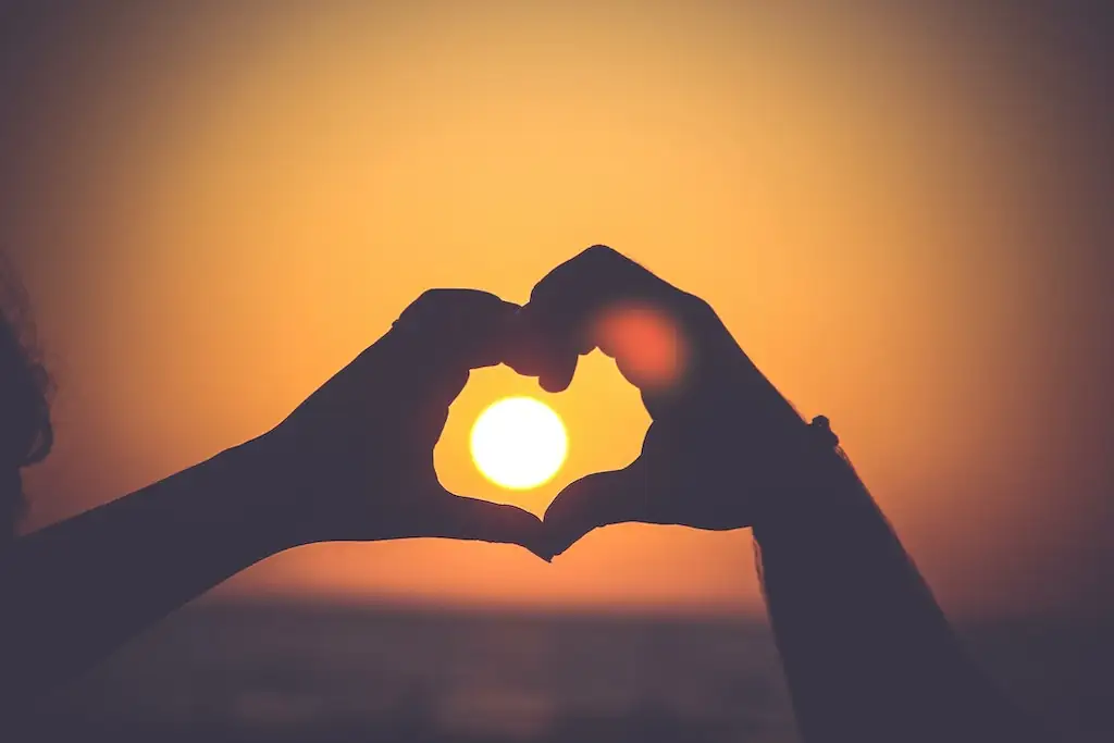 heart hands with the sun in the middle