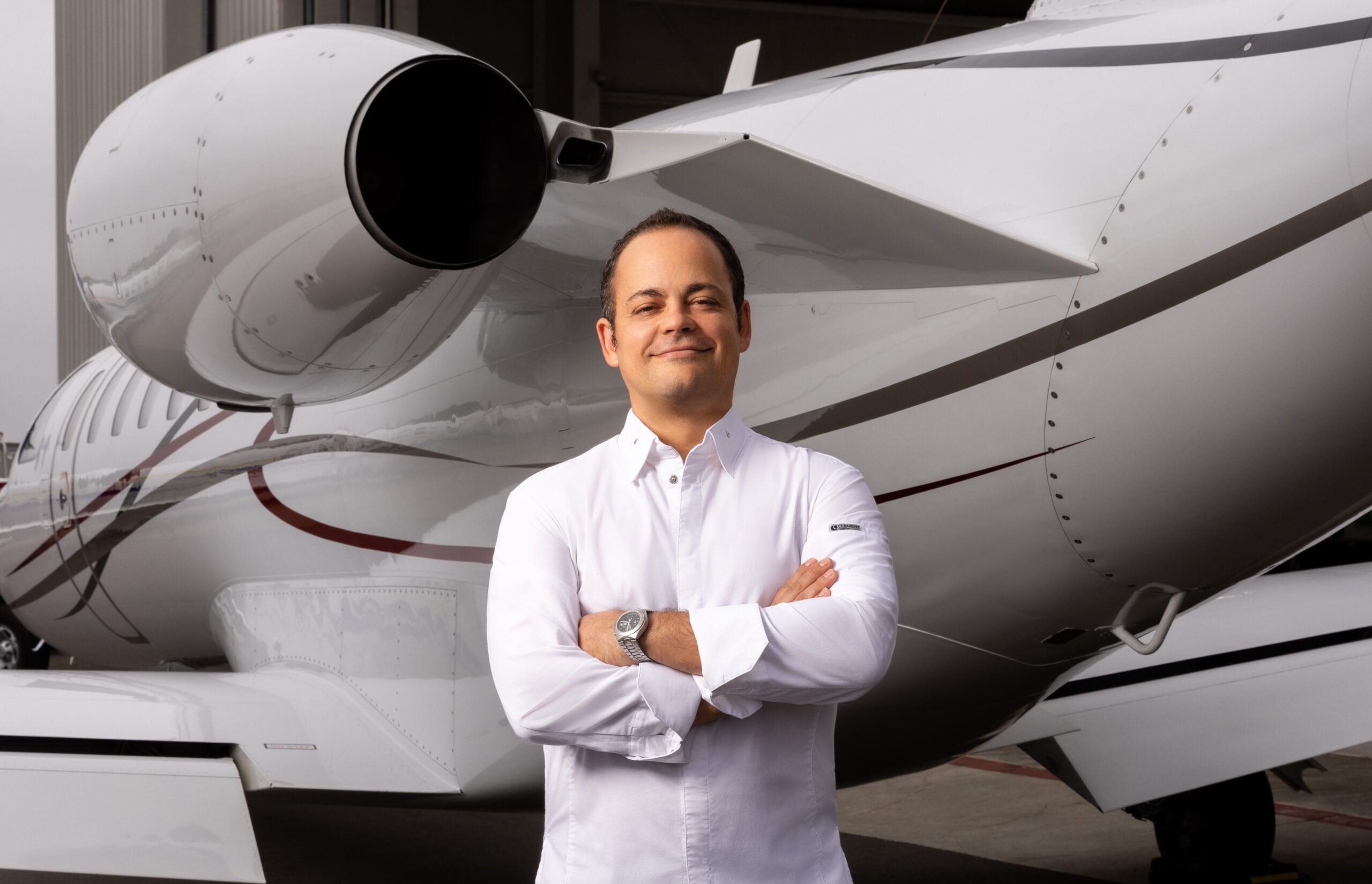 Chef Roberto Alcocer in front of private jet