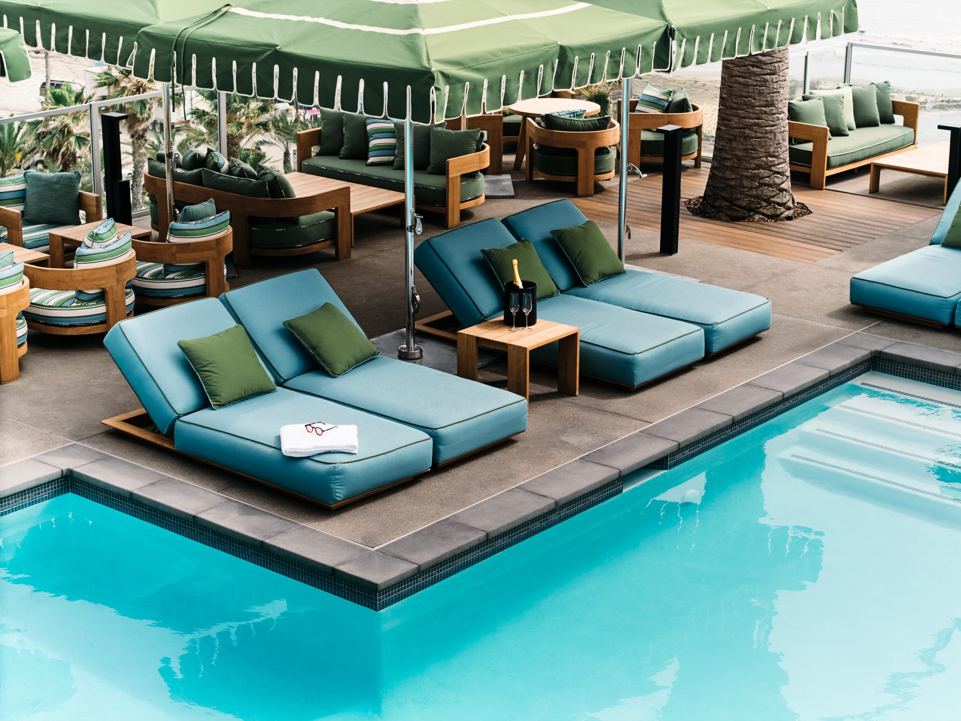 Lounge chairs and umbrellas next to pool
