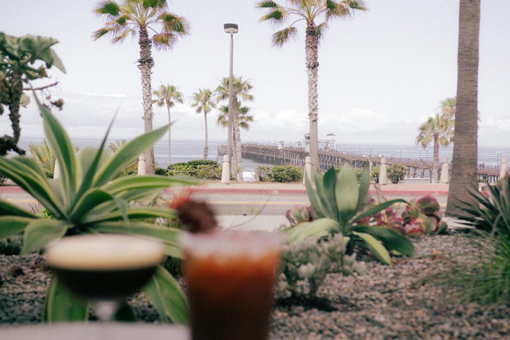 Espresso martini and Bloody Mary at The Cafe, with the Oceanside Pier in the background