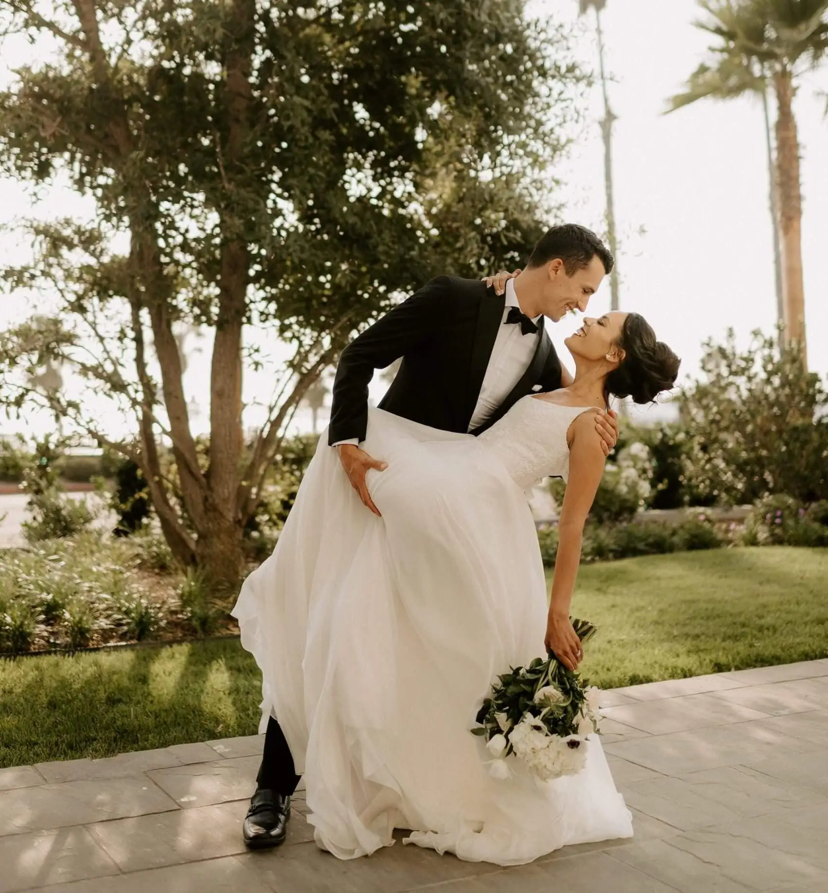 Newly married couple taking photos on their wedding day