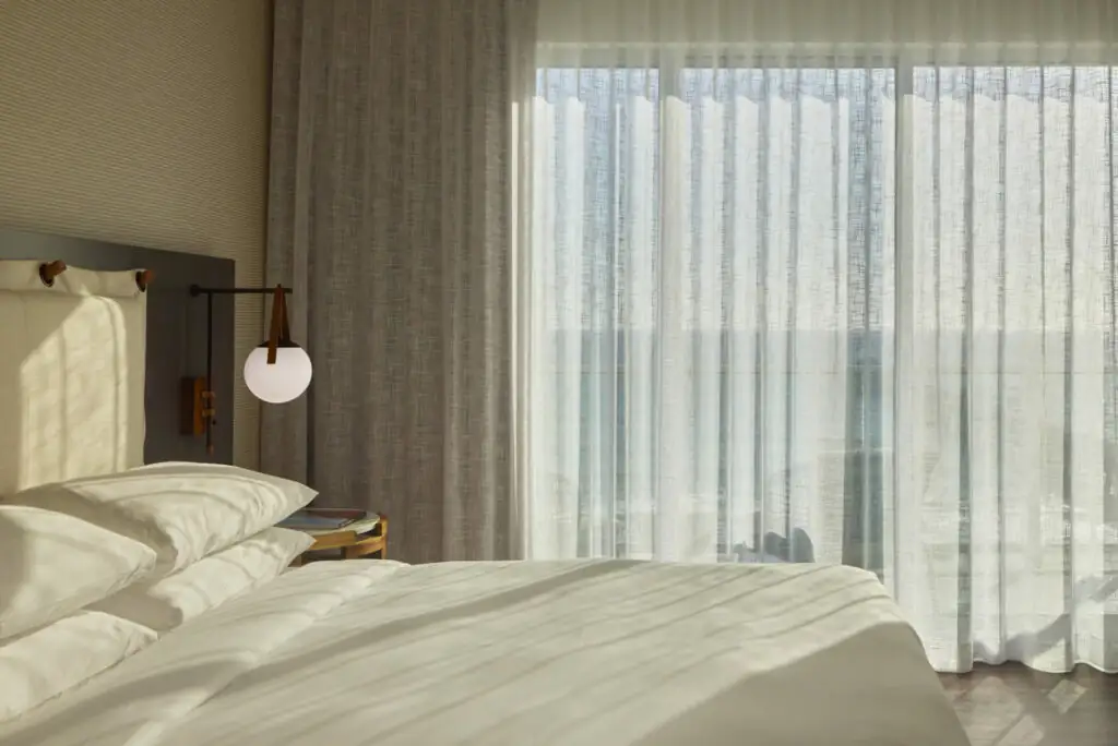 Room at mission pacific beach resort with a large king-size bed