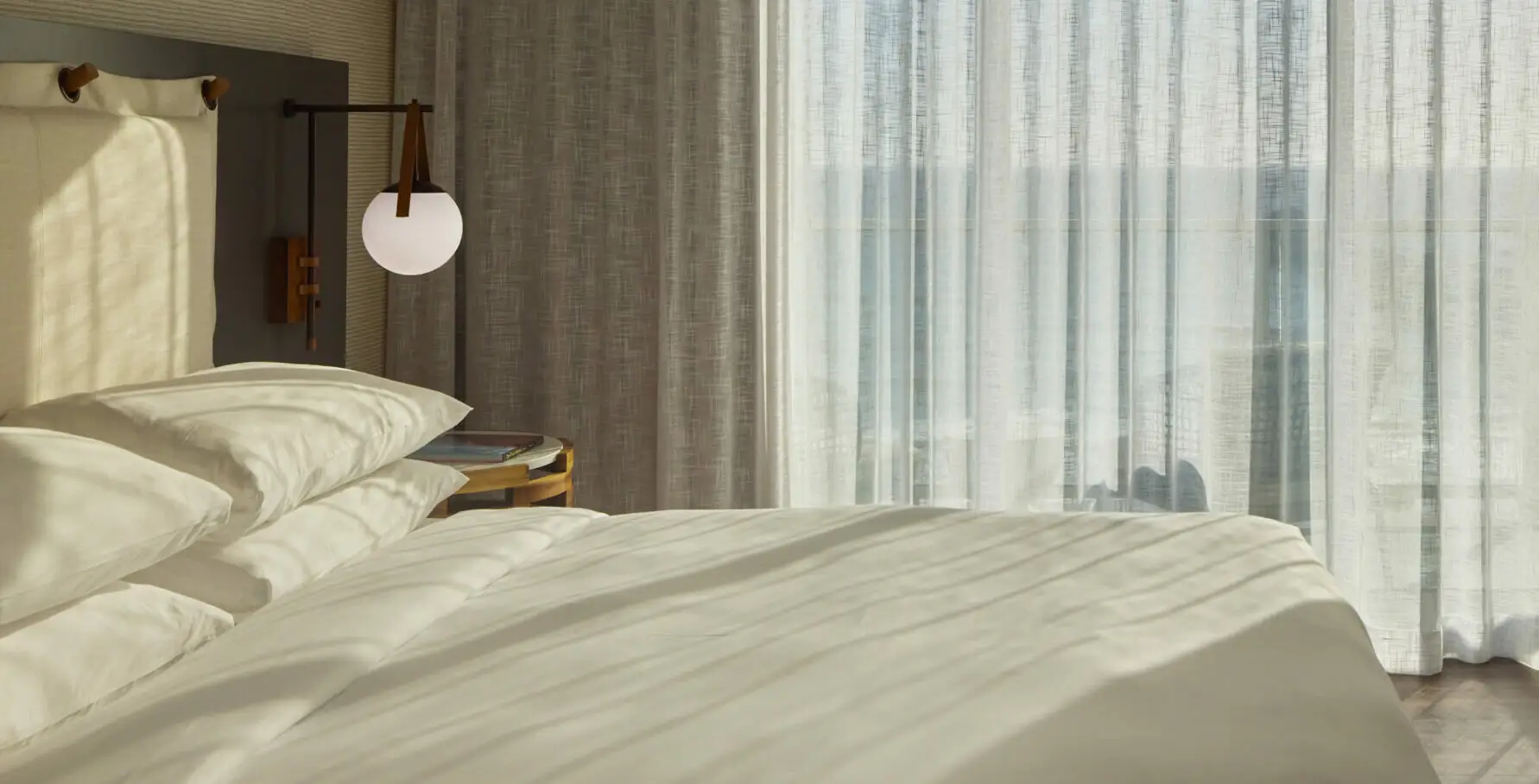 Room at mission pacific beach resort with a large king-size bed