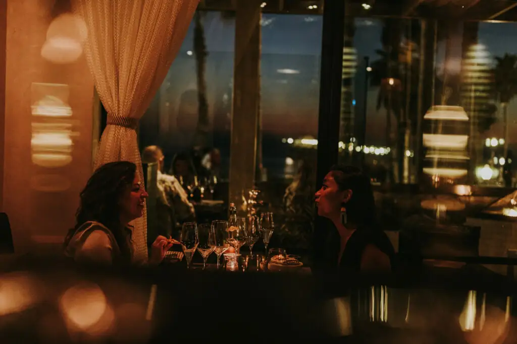 Two friends dining at valle restaurant