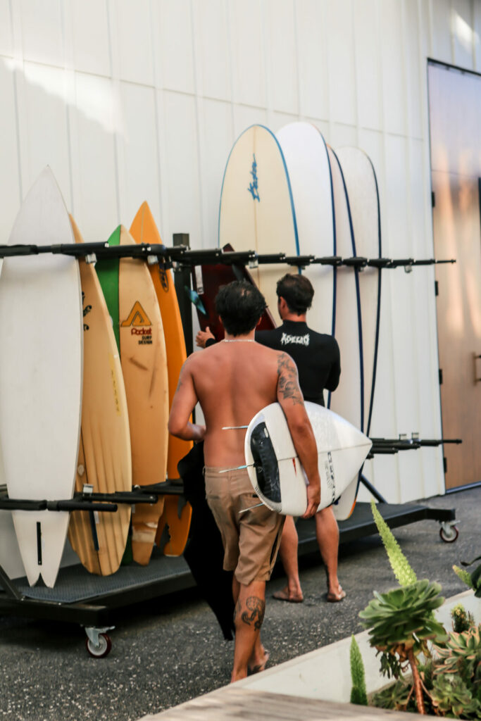 Two surfers storing their surfboards