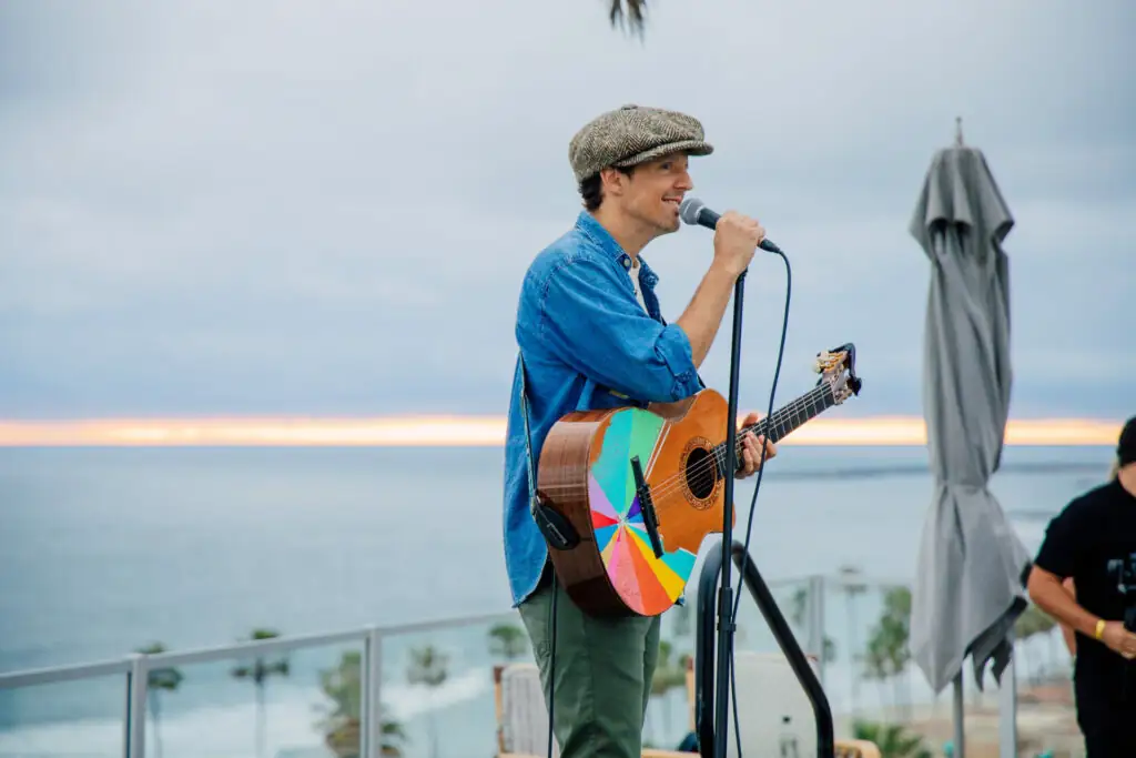 Singer playing guitar at the rooftop bar