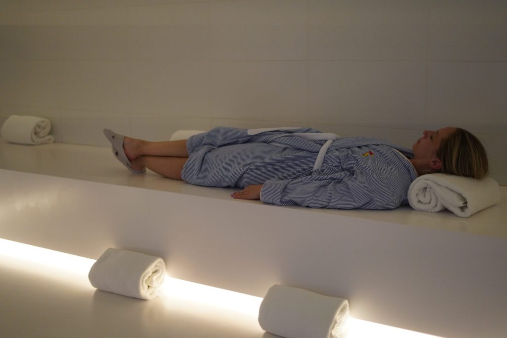 Guest relaxing in the sanarium at mission pacific's spa