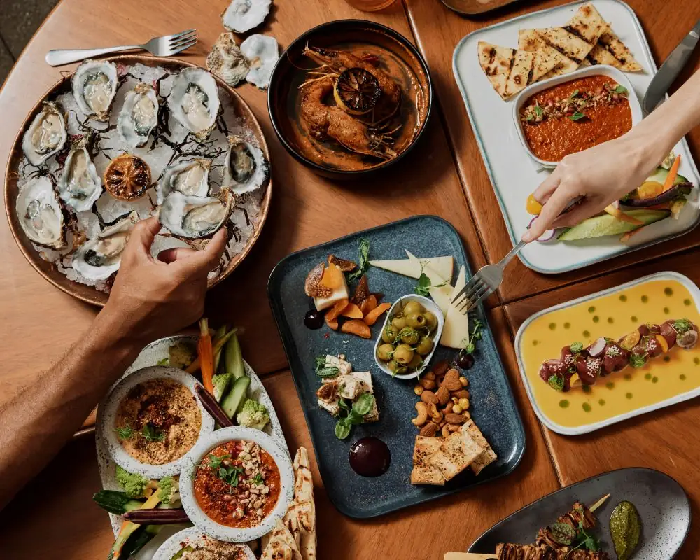 The rooftop bar's friendsgiving spread displayed on a table