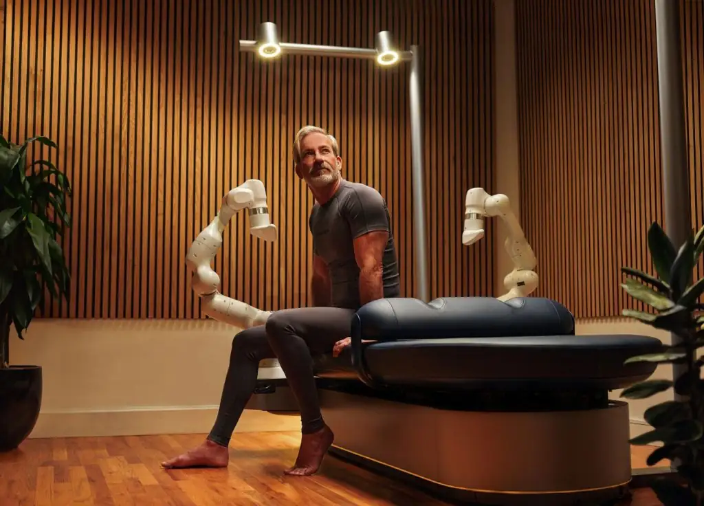Guest on the aescape robotic massage bed at mission pacific's spa